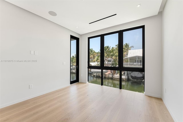 301 Buttonwood Cir # B, Key Largo, FL 33037 - spare room with light wood-style flooring and baseboards