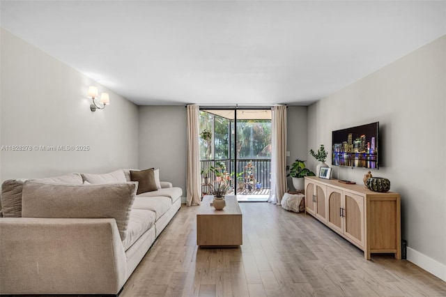 20367 W Country Club Dr Unit L25, Aventura, FL 33180 - living area featuring floor to ceiling windows and light wood finished floors