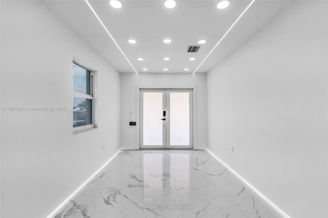 770 SE 5th Pl, Hialeah, FL 33010 - empty room with light marble finish floors, recessed lighting, and french doors