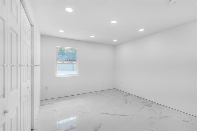 770 SE 5th Pl, Hialeah, FL 33010 - unfurnished bedroom featuring recessed lighting and light marble finish floors