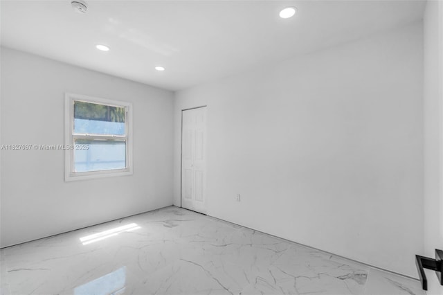 770 SE 5th Pl, Hialeah, FL 33010 - unfurnished room featuring light marble finish flooring, recessed lighting, and a smoke detector