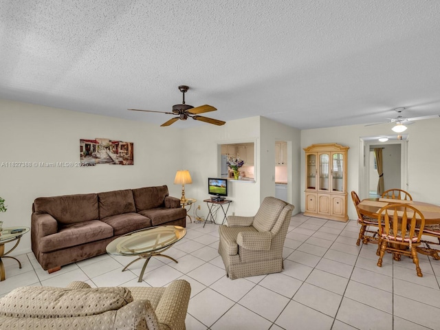 199 Durham D Unit 199, Deerfield Beach, FL 33442 - living room with a ceiling fan, a textured ceiling, and light tile patterned flooring