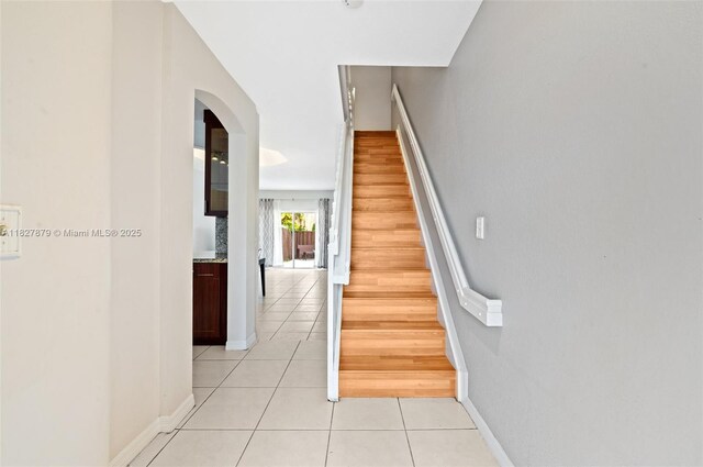 8366 NW 10th St Unit 3B, Miami, FL 33126 - stairs with tile patterned flooring and arched walkways