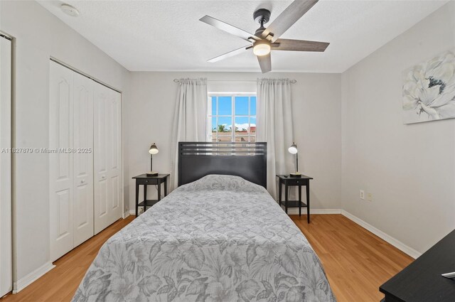 8366 NW 10th St Unit 3B, Miami, FL 33126 - bedroom with wood finished floors, ceiling fan, a closet, and a textured ceiling