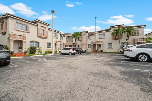 8366 NW 10th St Unit 3B, Miami, FL 33126 - uncovered parking lot with a residential view
