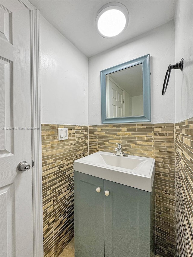 8103 SW 24th St, North Lauderdale, FL 33068 - bathroom with tile walls, vanity, and a wainscoted wall