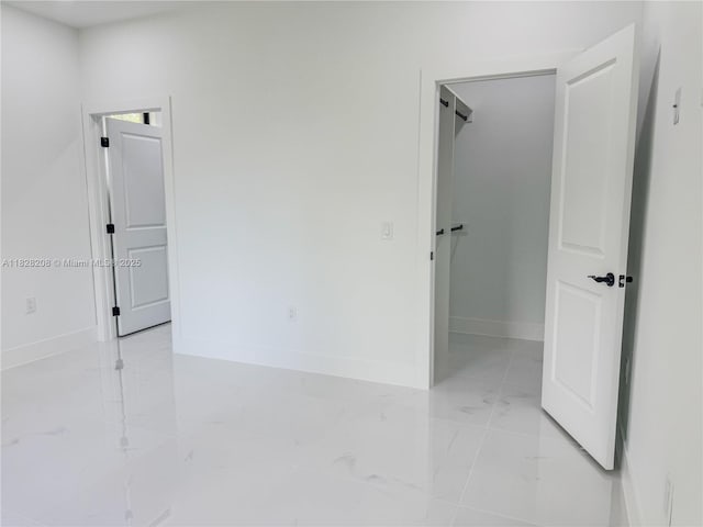 505 W 10th St, Lehigh Acres, FL 33972 - empty room with light marble finish floors and baseboards