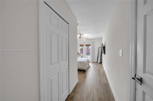 14795 SW 174th St, Miami, FL 33187 - hallway featuring dark wood finished floors and a textured ceiling