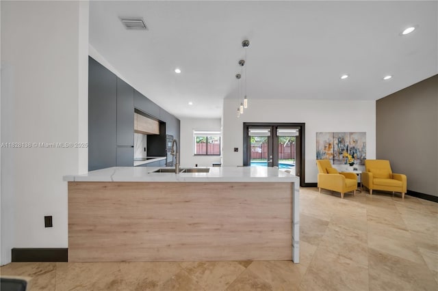 14795 SW 174th St, Miami, FL 33187 - kitchen featuring a peninsula, recessed lighting, modern cabinets, pendant lighting, and dark cabinets