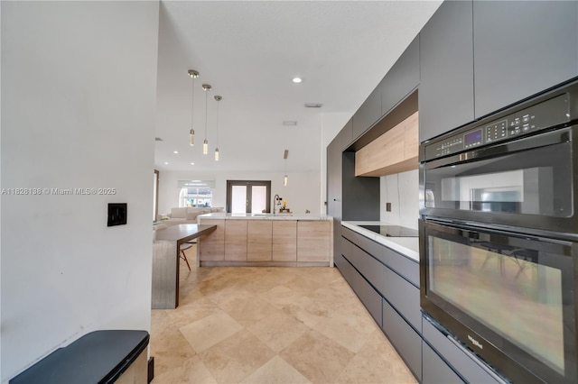 14795 SW 174th St, Miami, FL 33187 - kitchen featuring black appliances, modern cabinets, open floor plan, light countertops, and pendant lighting