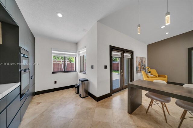 14795 SW 174th St, Miami, FL 33187 - kitchen featuring modern cabinets, decorative light fixtures, recessed lighting, light countertops, and a textured ceiling