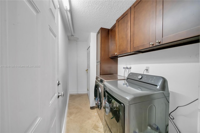 14795 SW 174th St, Miami, FL 33187 - laundry area featuring cabinet space, a textured ceiling, and washing machine and dryer