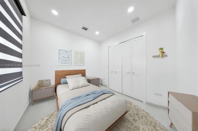 1550 SW 89th Ct, Miami, FL 33174 - bedroom with concrete flooring, recessed lighting, and a closet