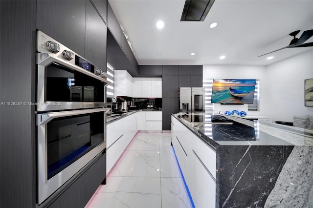 1550 SW 89th Ct, Miami, FL 33174 - kitchen featuring appliances with stainless steel finishes, modern cabinets, light marble finish flooring, recessed lighting, and dark stone counters