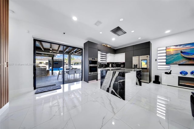 1550 SW 89th Ct, Miami, FL 33174 - kitchen with appliances with stainless steel finishes, modern cabinets, dark cabinetry, a center island, and recessed lighting