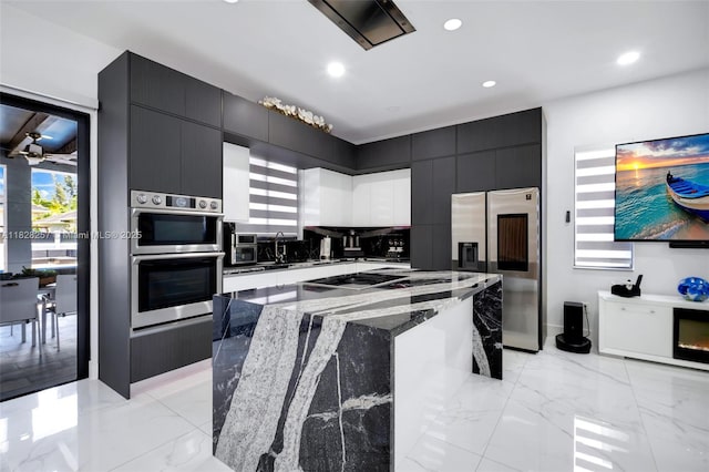 1550 SW 89th Ct, Miami, FL 33174 - kitchen with stainless steel appliances, dark cabinets, a center island, modern cabinets, and recessed lighting