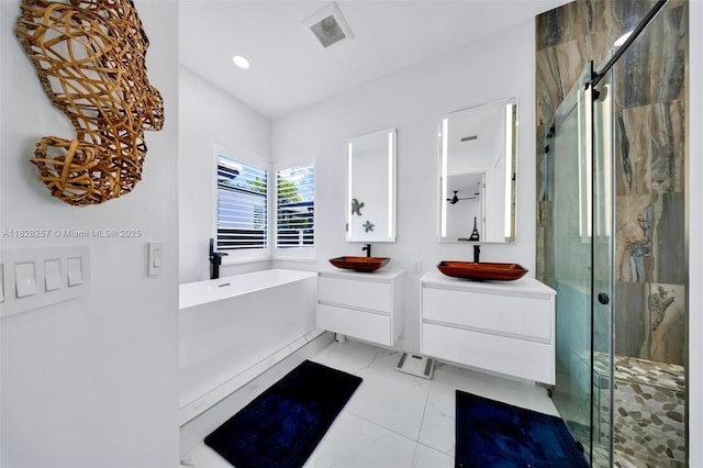 1550 SW 89th Ct, Miami, FL 33174 - bathroom featuring marble finish floors, two vanities, a soaking tub, a marble finish shower, and recessed lighting