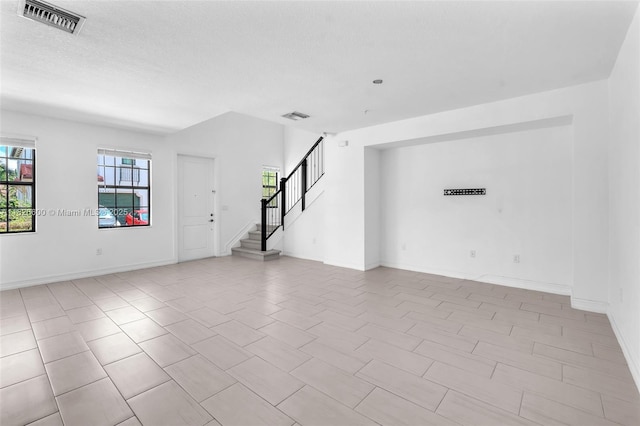 11735 SW 13th Ct, Pembroke Pines, FL 33025 - unfurnished living room featuring stairs and light tile patterned floors