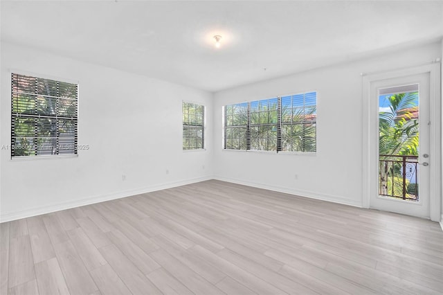 11735 SW 13th Ct, Pembroke Pines, FL 33025 - spare room with light wood-style flooring and baseboards