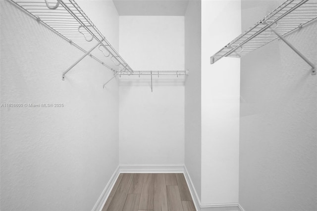 11735 SW 13th Ct, Pembroke Pines, FL 33025 - spacious closet with wood finished floors