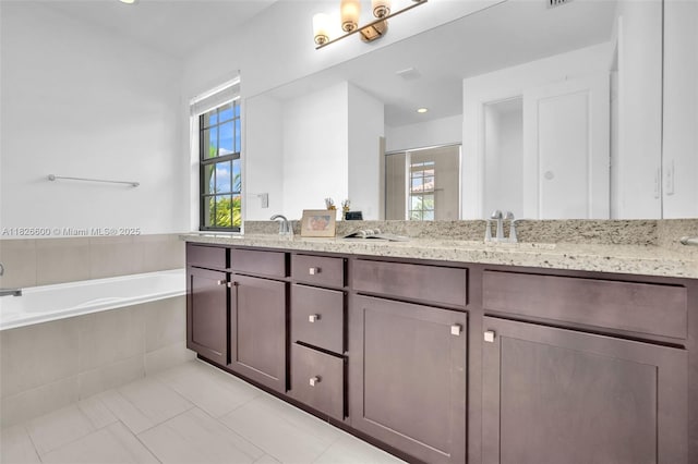 11735 SW 13th Ct, Pembroke Pines, FL 33025 - full bathroom with double vanity, a garden tub, a shower stall, and tile patterned flooring