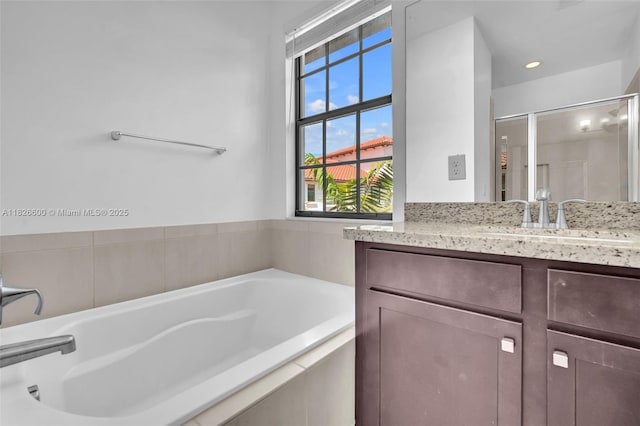 11735 SW 13th Ct, Pembroke Pines, FL 33025 - bathroom with vanity, a bath, plenty of natural light, and a shower stall