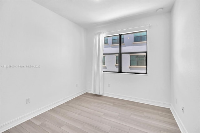 11735 SW 13th Ct, Pembroke Pines, FL 33025 - empty room featuring wood finished floors and baseboards