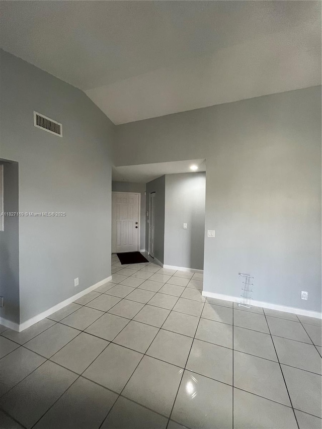 6298 NW 170th Ln, Hialeah, FL 33015 - empty room with light tile patterned floors and lofted ceiling