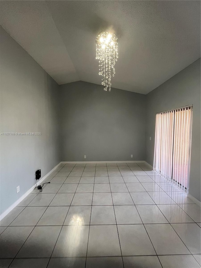 6298 NW 170th Ln, Hialeah, FL 33015 - spare room with vaulted ceiling, a chandelier, light tile patterned floors, and a textured ceiling