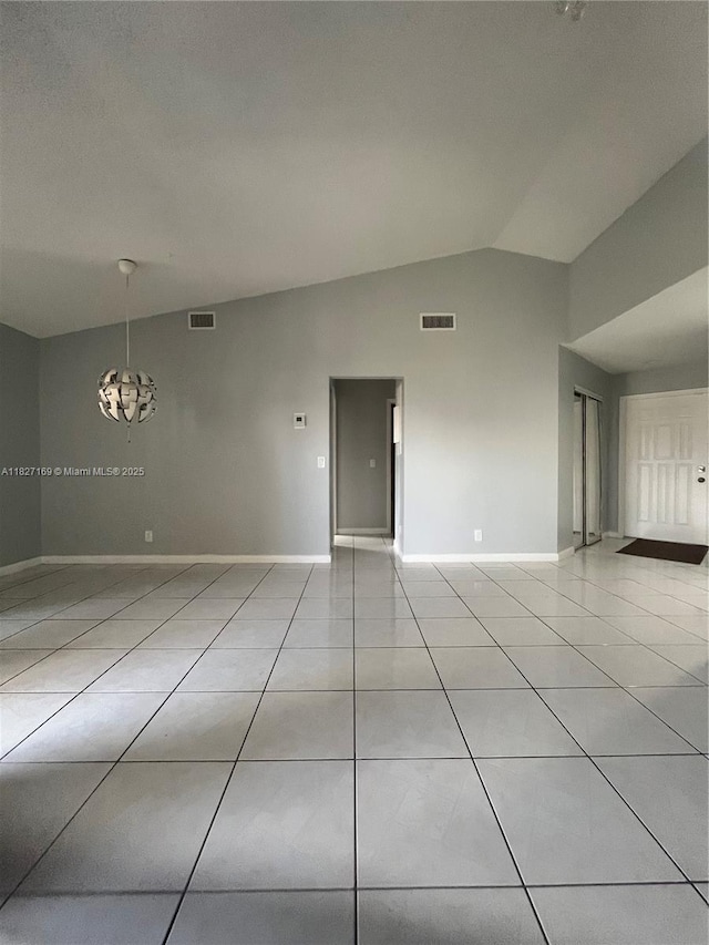 6298 NW 170th Ln, Hialeah, FL 33015 - empty room featuring lofted ceiling and light tile patterned floors