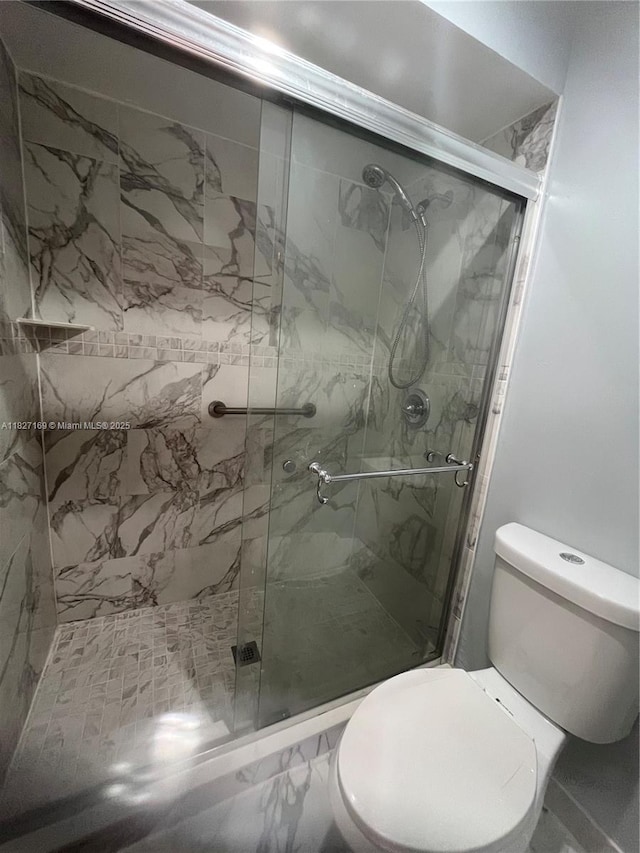 6298 NW 170th Ln, Hialeah, FL 33015 - bathroom featuring a marble finish shower and marble finish floors