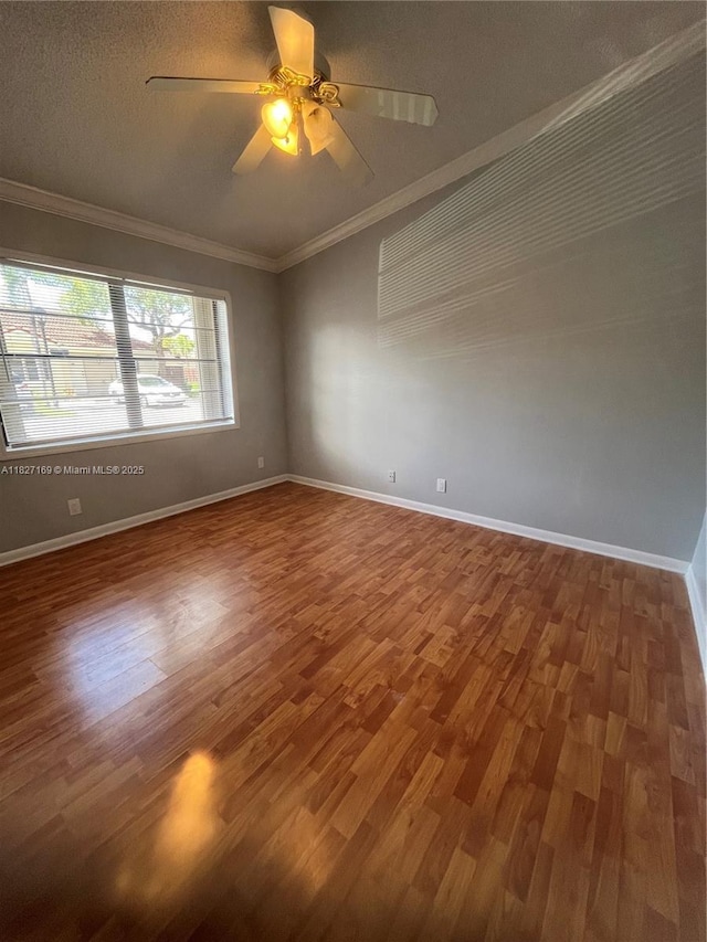 6298 NW 170th Ln, Hialeah, FL 33015 - spare room with wood finished floors, ornamental molding, ceiling fan, and a textured ceiling