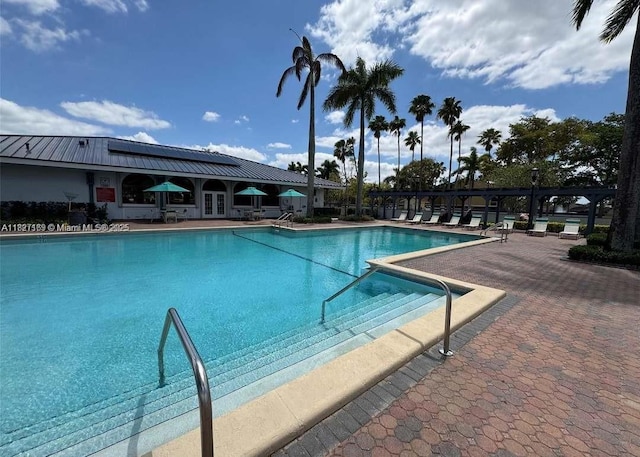 6298 NW 170th Ln, Hialeah, FL 33015 - community pool with a patio and french doors