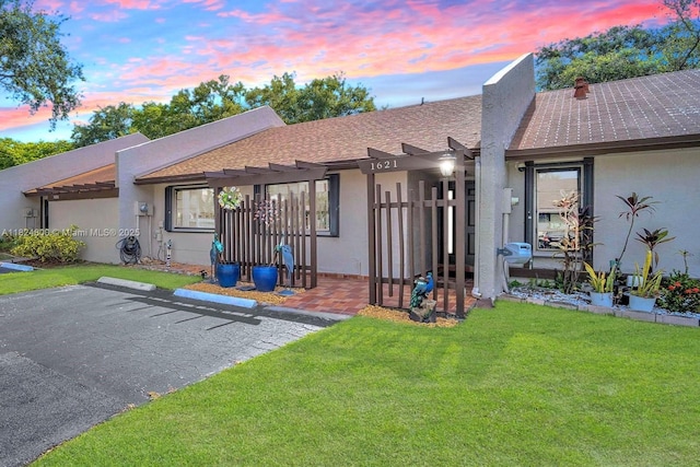 1621 NW 96th Ter, Pembroke Pines, FL 33024 - view of front of house featuring a pergola, a lawn, stucco siding, and roof with shingles