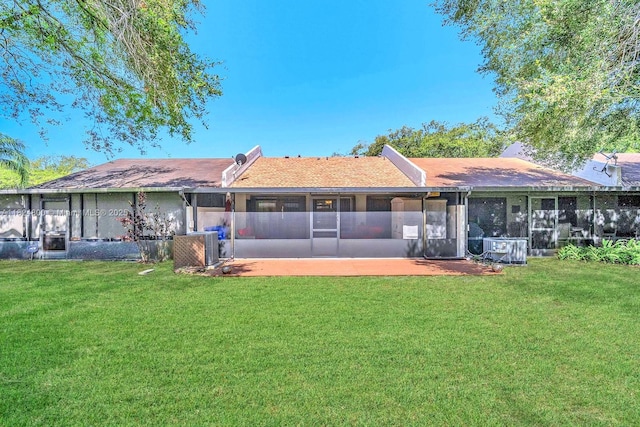 1621 NW 96th Ter, Pembroke Pines, FL 33024 - rear view of house featuring a lawn, a sunroom, and a patio area