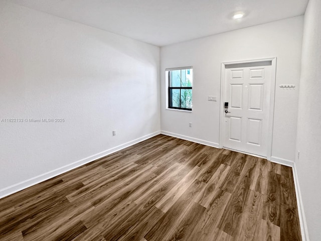 6011 W Paso Fino Pl, Davie, FL 33314 - entryway featuring dark wood-style flooring and baseboards