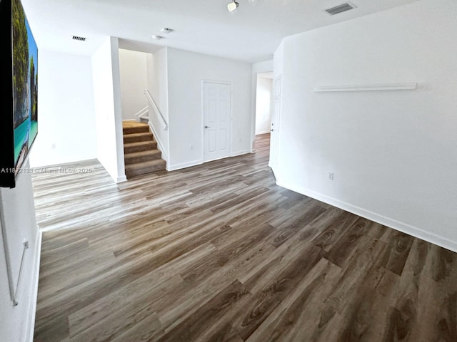 6011 W Paso Fino Pl, Davie, FL 33314 - unfurnished living room featuring wood finished floors and stairs