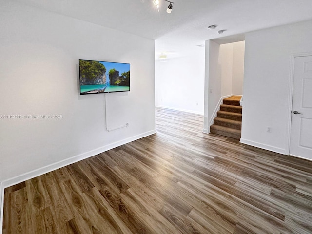 6011 W Paso Fino Pl, Davie, FL 33314 - spare room featuring wood finished floors and stairway