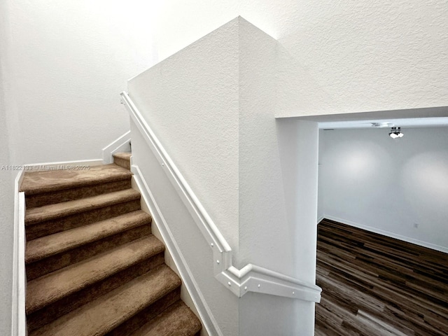 6011 W Paso Fino Pl, Davie, FL 33314 - staircase featuring wood finished floors and baseboards