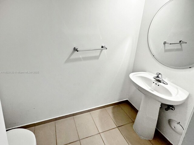 6011 W Paso Fino Pl, Davie, FL 33314 - bathroom with tile patterned flooring and baseboards