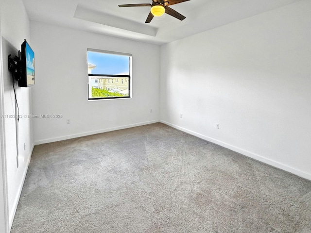 6011 W Paso Fino Pl, Davie, FL 33314 - carpeted empty room featuring a ceiling fan and a tray ceiling