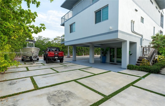 475 Bahia Honda Rd, Key Largo, FL 33037 - back of property featuring french doors and stucco siding