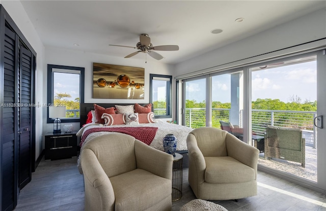 475 Bahia Honda Rd, Key Largo, FL 33037 - bedroom featuring multiple windows, access to outside, wood finished floors, and a ceiling fan