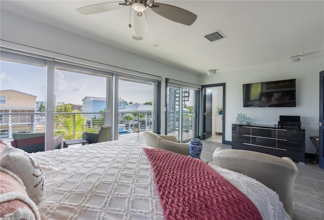 475 Bahia Honda Rd, Key Largo, FL 33037 - bedroom featuring access to outside, multiple windows, wood finished floors, and a ceiling fan