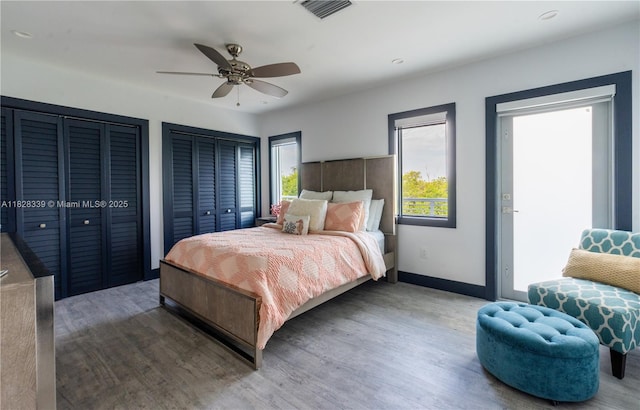 475 Bahia Honda Rd, Key Largo, FL 33037 - bedroom featuring wood finished floors, multiple closets, and a ceiling fan