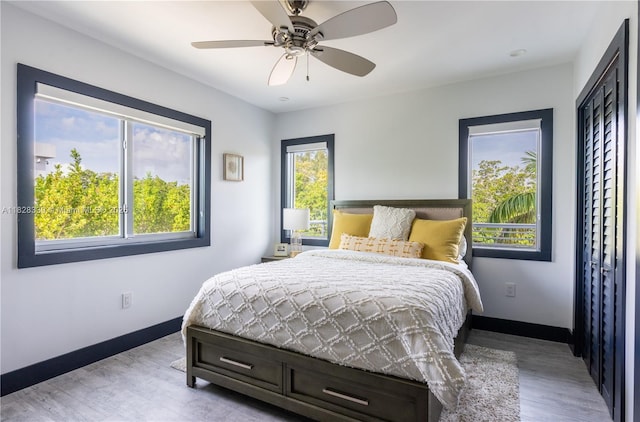 475 Bahia Honda Rd, Key Largo, FL 33037 - bedroom featuring light wood-type flooring and a ceiling fan