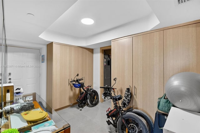 18671 Collins Ave Unit 1401, Sunny Isles Beach, FL 33160 - workout room featuring a tray ceiling