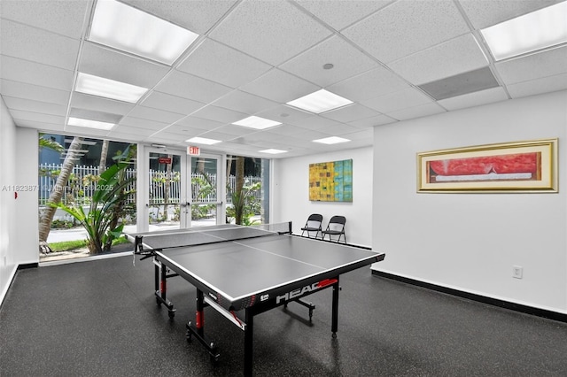 18671 Collins Ave Unit 1401, Sunny Isles Beach, FL 33160 - rec room featuring a drop ceiling, rubber floors, and french doors