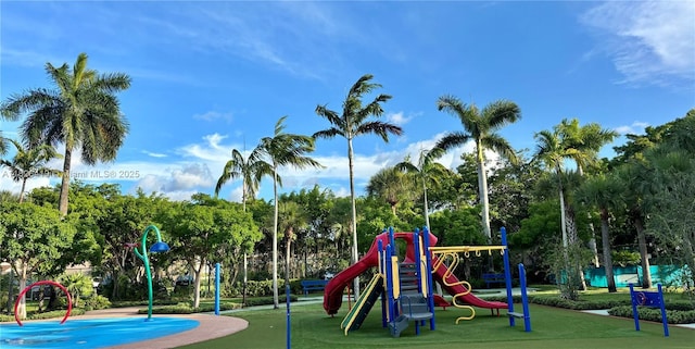 9725NW NW 52nd St Unit 415, Doral, FL 33178 - community playground featuring a yard and view of scattered trees