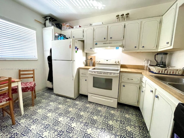 2860 SW 22nd Ave Unit 4100, Delray Beach, FL 33445 - kitchen with white appliances, under cabinet range hood, and light countertops